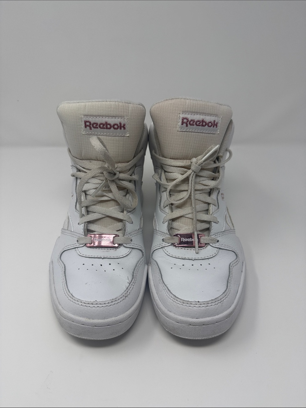 Reebok White High-Top Sneakers with Light Pink Logo Accents